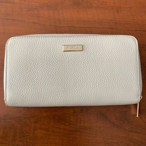 New W/O tags. Ivory leather zip around wallet